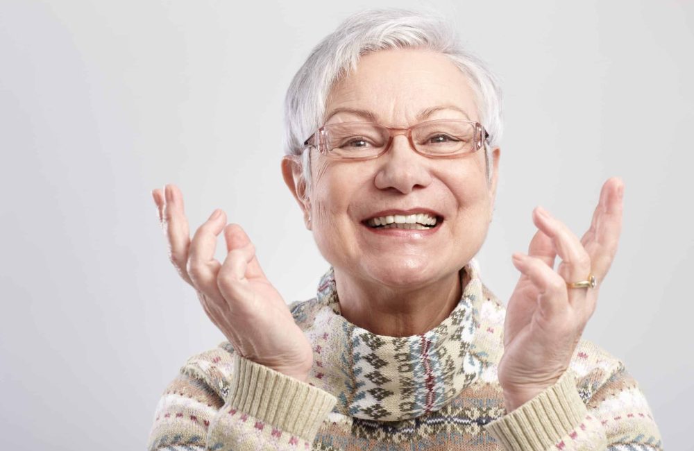 Closeup,Portrait,Of,Happy,Old,Woman,Gesturing,By,Hands.