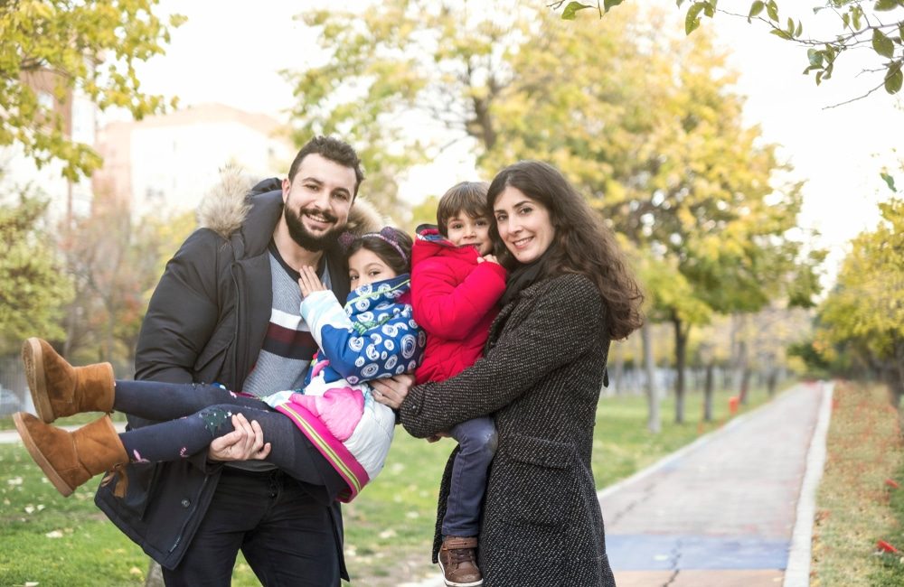 Autumn,Image,Of,Happy,Of,Four,Members,Family,In,Public