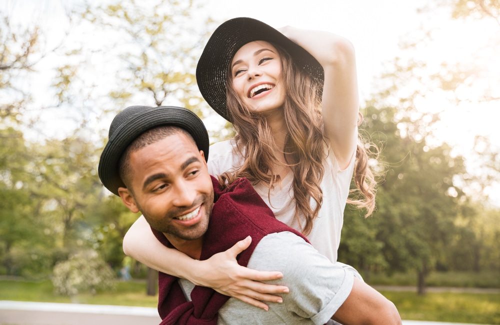 Happy,Young,Couple,Having,Fun,Outdoors,Together